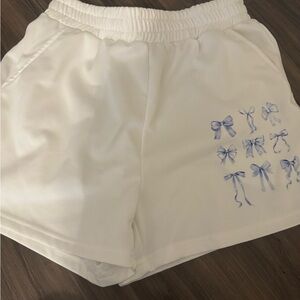 SHEIN White Athletic Shorts with Blue Bow Accents
